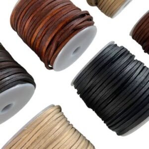 Spools of flat leather cords in various colors neatly arranged on a clean background.