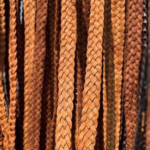 Close-up of braided leather cords in various brown shades