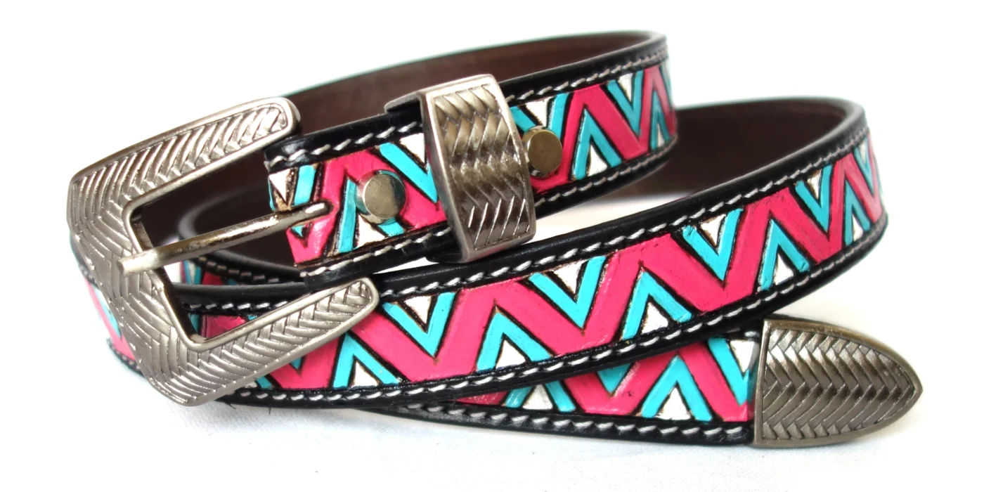 Handcrafted leather belt with pink, turquoise, and white chevron pattern and silver buckle.