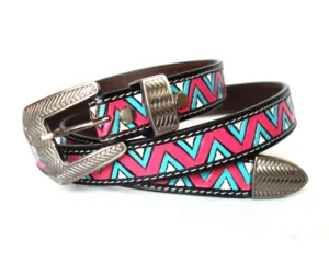 Handcrafted leather belt with pink, turquoise, and white chevron pattern and silver buckle.