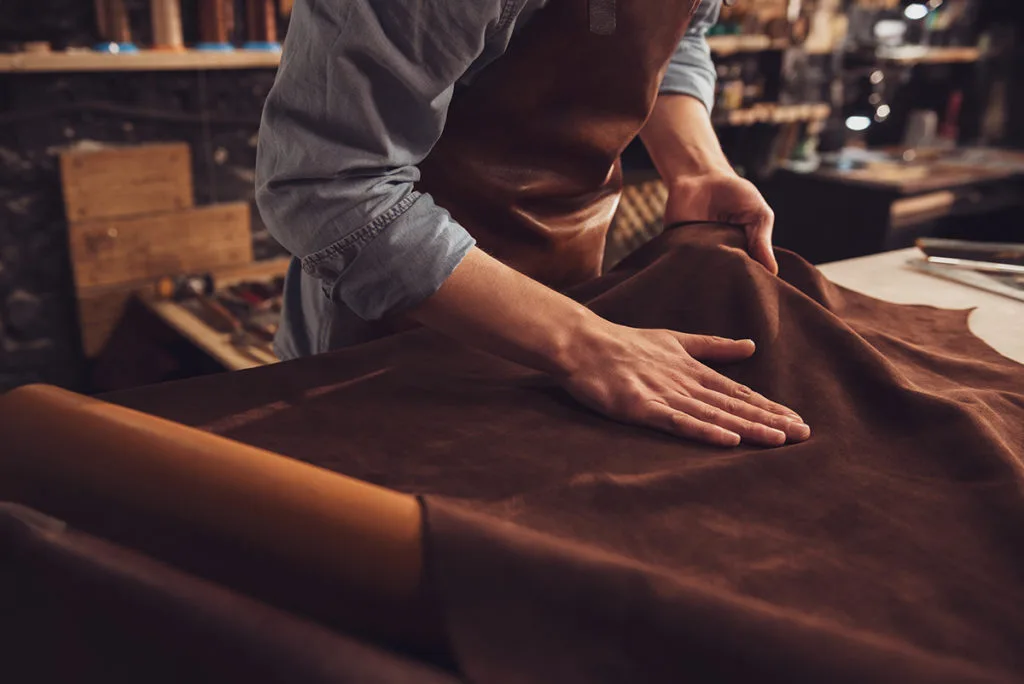 Artisan working with leather in a workshop